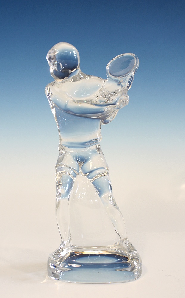 A Baccarat crystal figurine of a tennis player with etched factory mark and engraved `Baccarat`