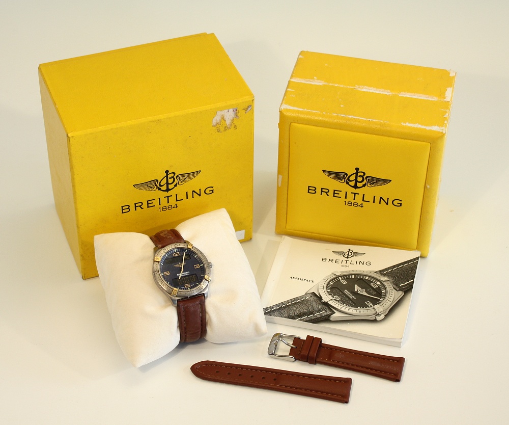 A Breitling Aerospace watch titanium and crystal case, blue face with two rectangular digital