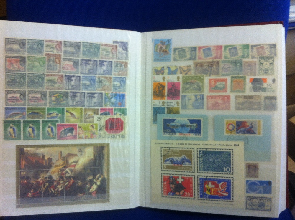 STAMPS : World collection in red stock book , 100's of stamps plus a few covers, mainly used.