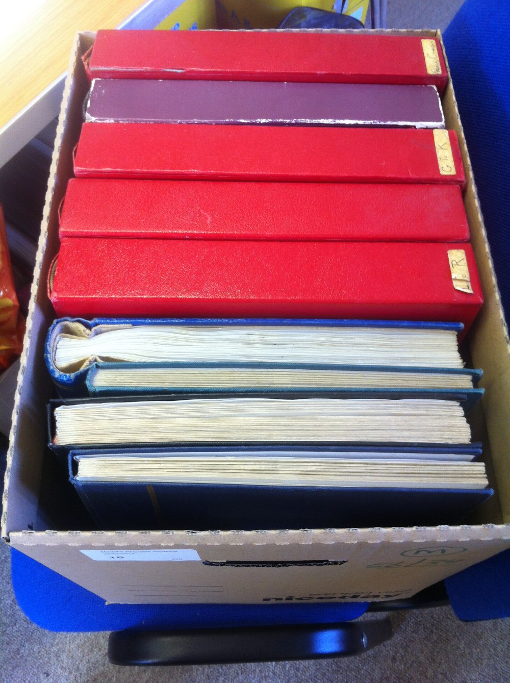 Box containing six spring-back albums and three stock-books, crammed with stamps, worldwide