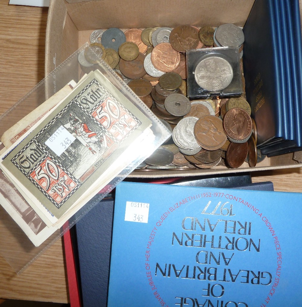 A collection of coin presentation packs; banknotes; etc.
