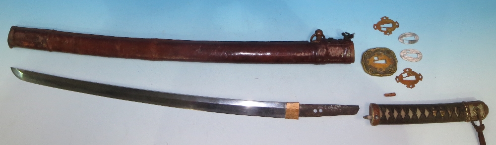 A Japanese officer`s sword o-wakizashi, the family blade with visible hamon and signature to tang,