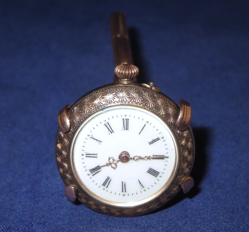 A silver gilt Edwardian lady`s fob watch in gold plated expanding wrist strap