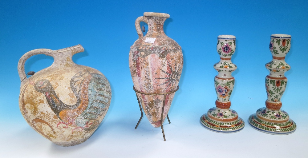 A reproduction Ancient Greek Amphora and similar jug; a pair of modern Delft candlesticks