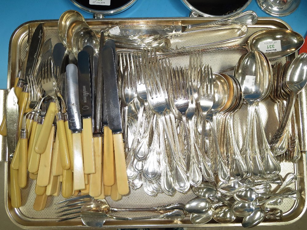 An early 20th century 12 setting canteen of silver plated cutlery with reeded oval terminals and