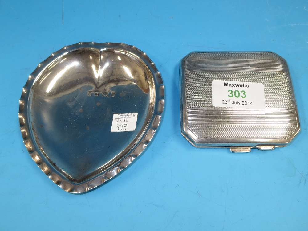 A silver heart shaped tray and a silver cigarette case