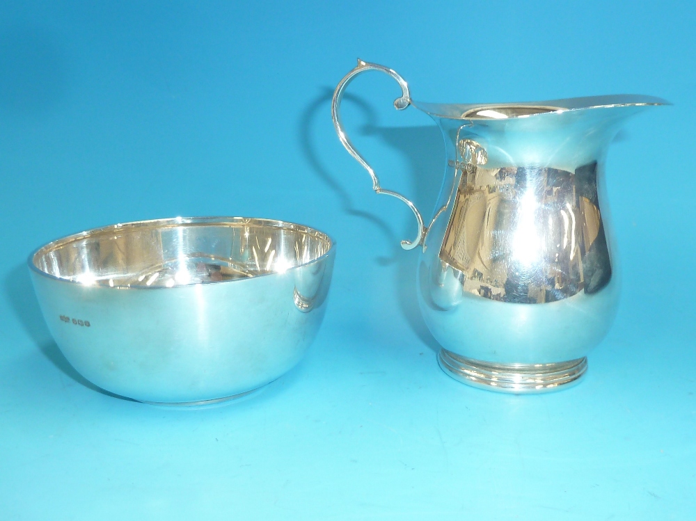 A circular silver sugar bowl; a continental jug