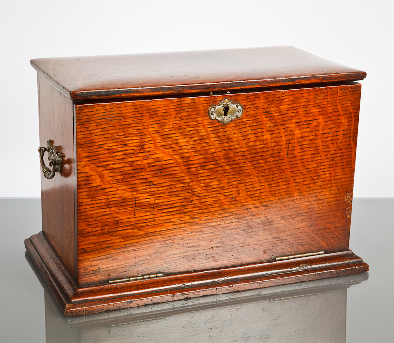 VICTORIAN OAK STATIONARY CASKET the hinged front with folding lap desk, with accessories including