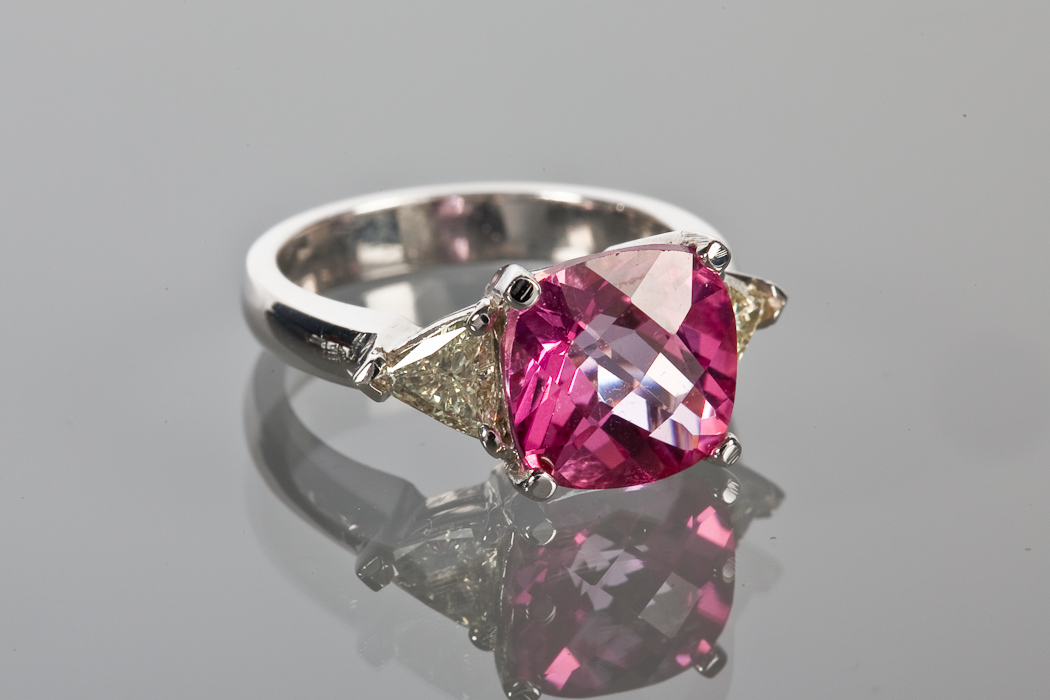 PINK TOPAZ AND DIAMOND THREE STONE RING the central square modified modern cushion pink topaz