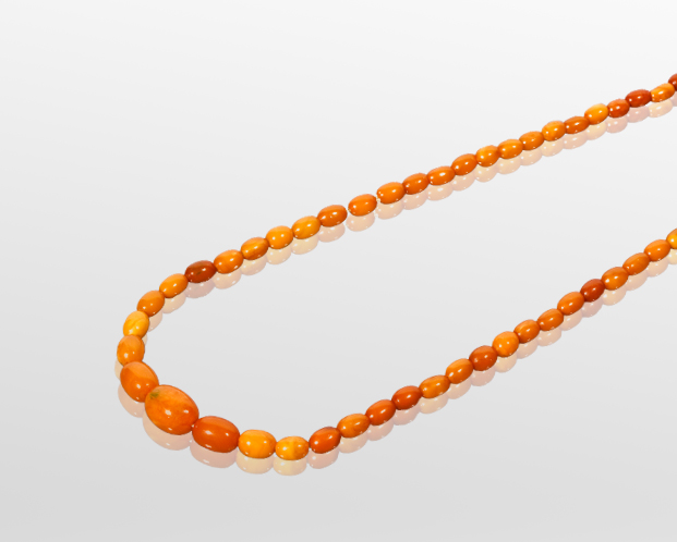 GRADUATED AMBER BEAD NECKLACE the largest bead 20mm diameter, the smallest bead 7mm diameter, 61cm