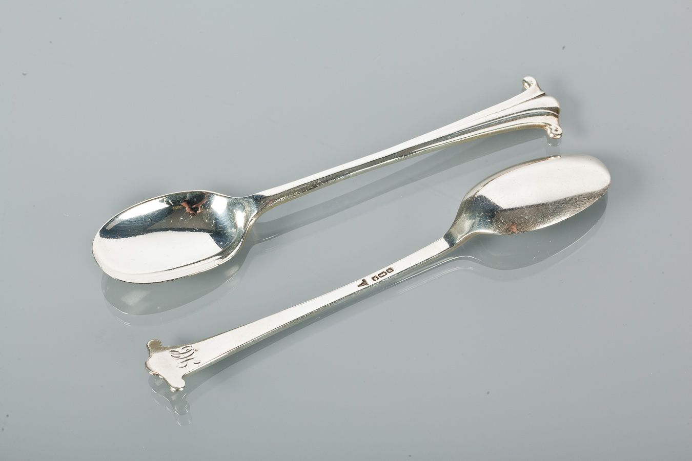 SET OF TWELVE SILVER TEASPOONS maker Walker & Hall, with scroll terminals, 12.5cm long