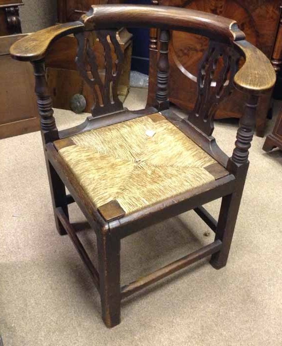 GEORGE III OAK CORNER CHAIR with pierced vase shaped splts and rush seat, on square legs, 78cm high
