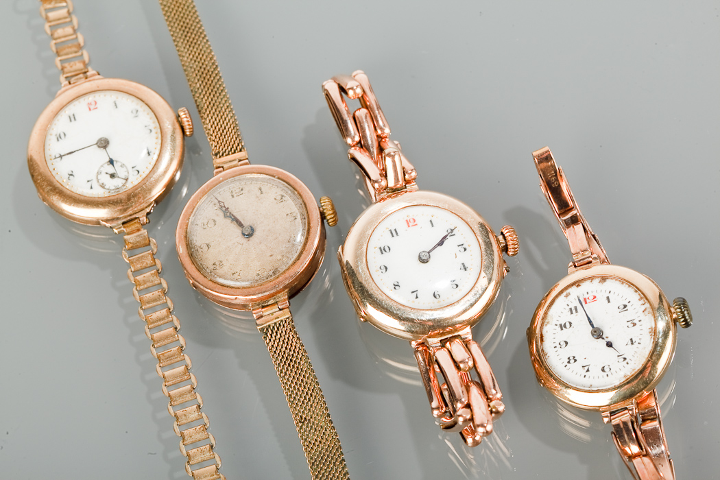 THREE LADY`S EARLY TWENTIETH CENTURY WRIST WATCHES comprising one with a round white dial with