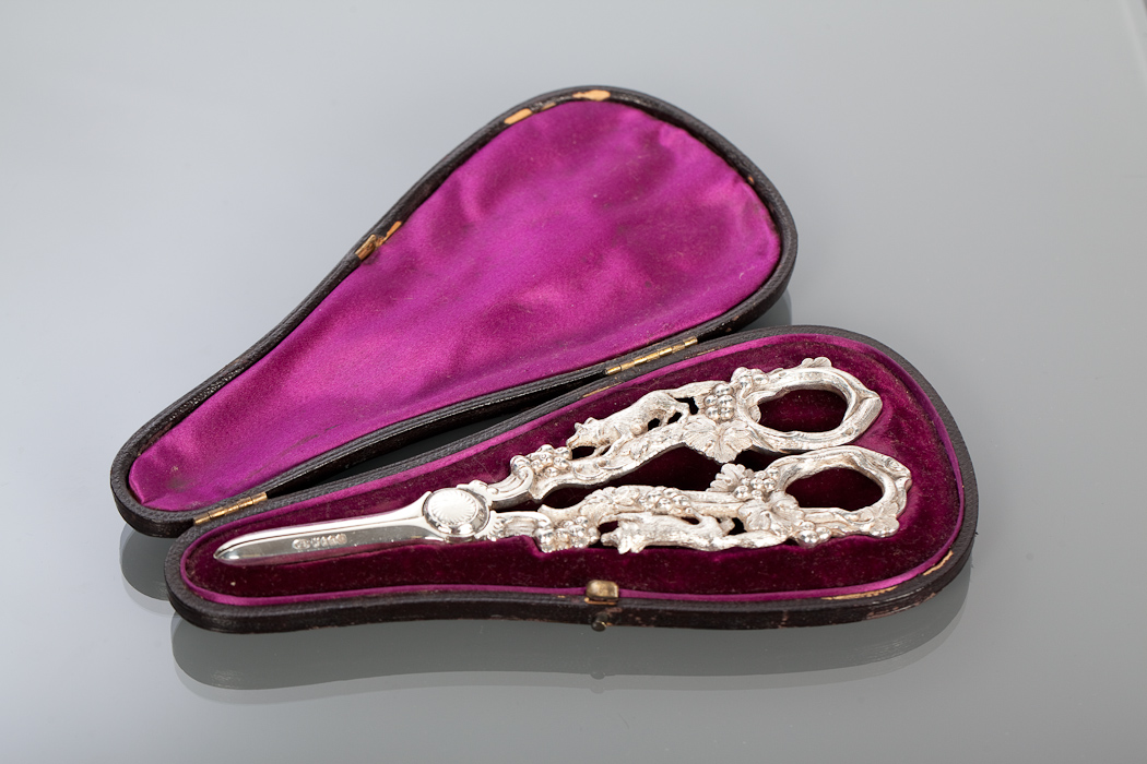 PAIR OF SILVER PLATED GRAPE SHEARS modelled with a fox among fruiting vines, in fitted case, maker