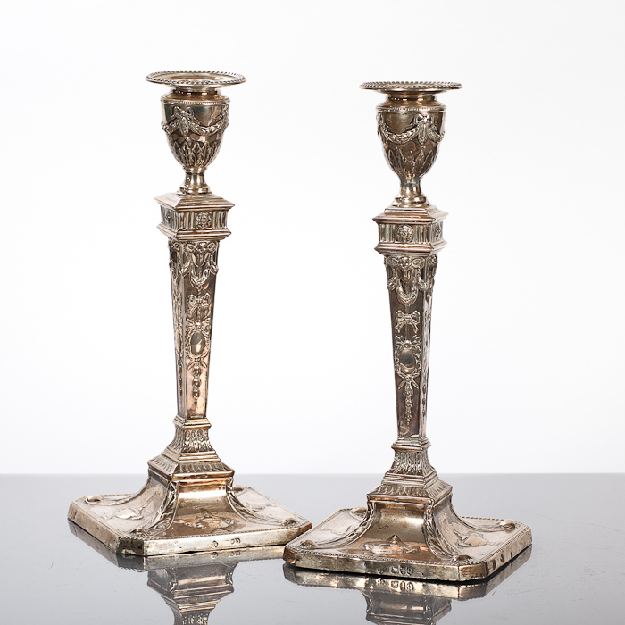 PAIR OF ADAM DESIGN SILVER TABLE CANDLESTICKS with detachable nozzles, urn shaped sconces and