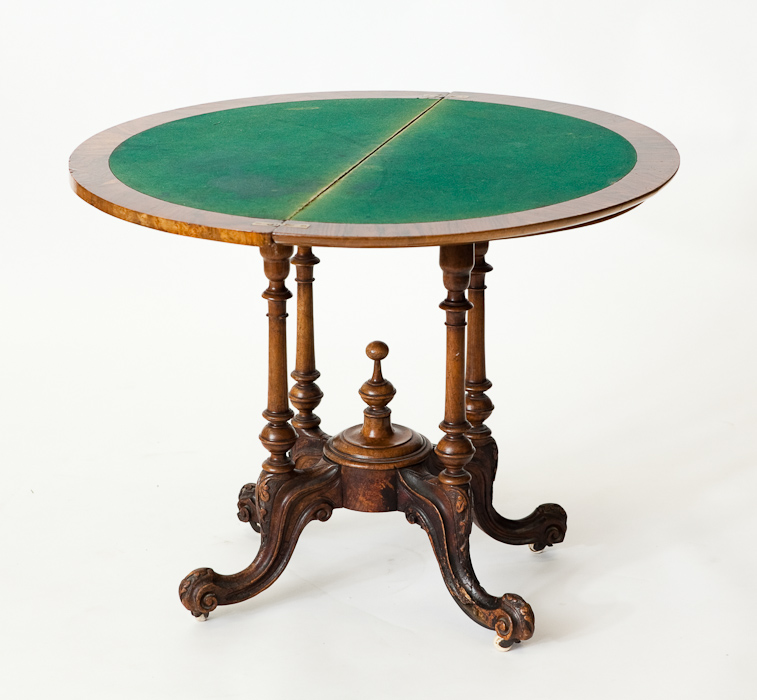 VICTORIAN WALNUT DEMI LUNE CARD TABLE on four column supports and cabriole legs, 72cm high