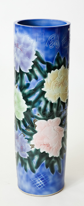 MODERN CHINESE ORNAMENTAL GARDEN SLEEVE VASE modelled with flowers, signed, 112cm high