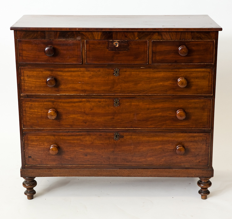 VICTORIAN MAHOGANY CHEST OF DRAWERS with three short and three long graduated drawers, on turned