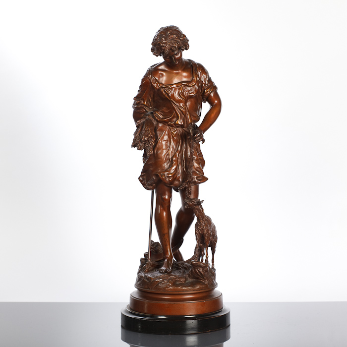 EARLY 20TH CENTURY PATINATED SPELTER FIGURE OF A MAN carrying a bushel of wheat and standing beside