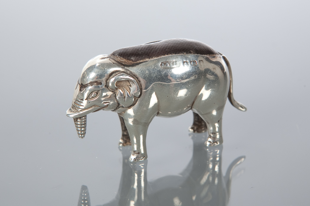 EARLY 20TH CENTURY NOVELTY PIN CUSHION in the form of an elephant, missing end of trunk, 4.5cm long