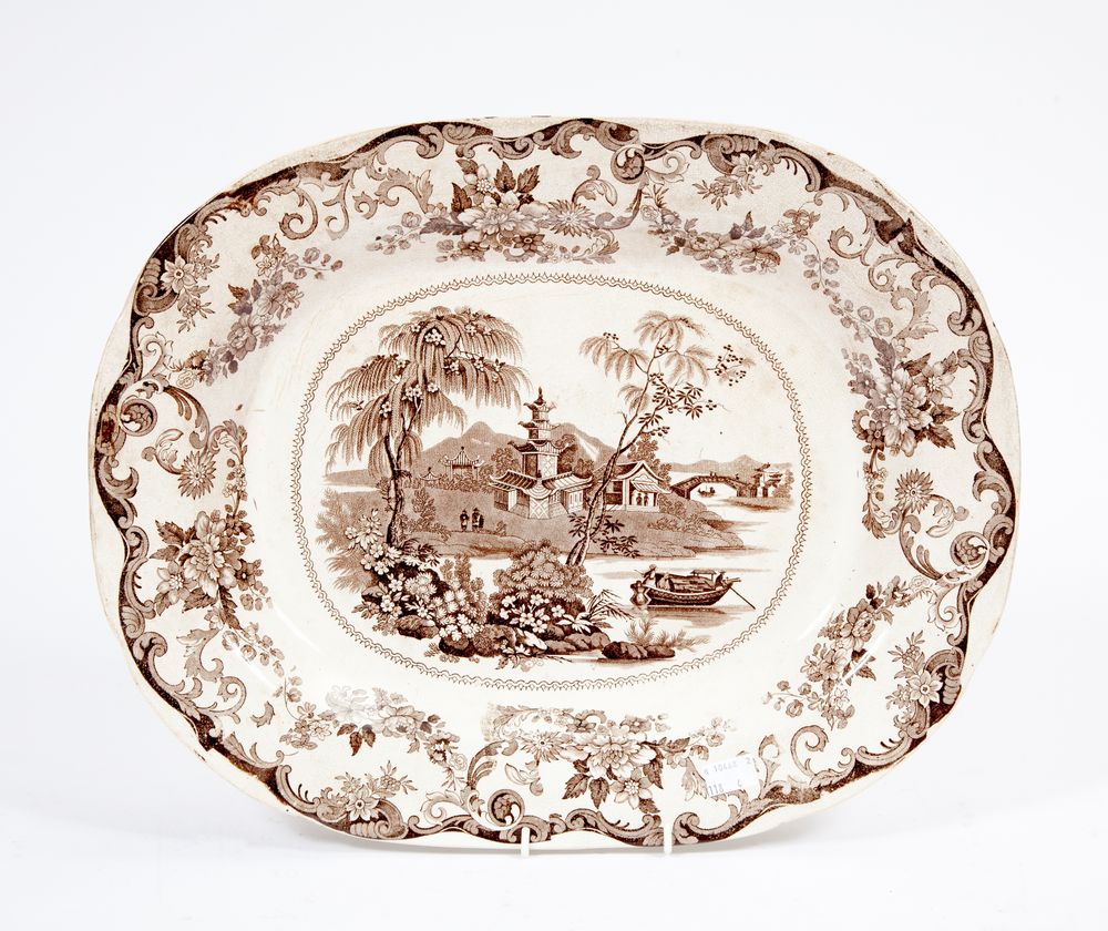 A SET OF FOUR BROWN AND WHITE CHINOISERIE PRINTED MEAT PLATTERS,
Late 19th century, 18in (46cm). (4)
