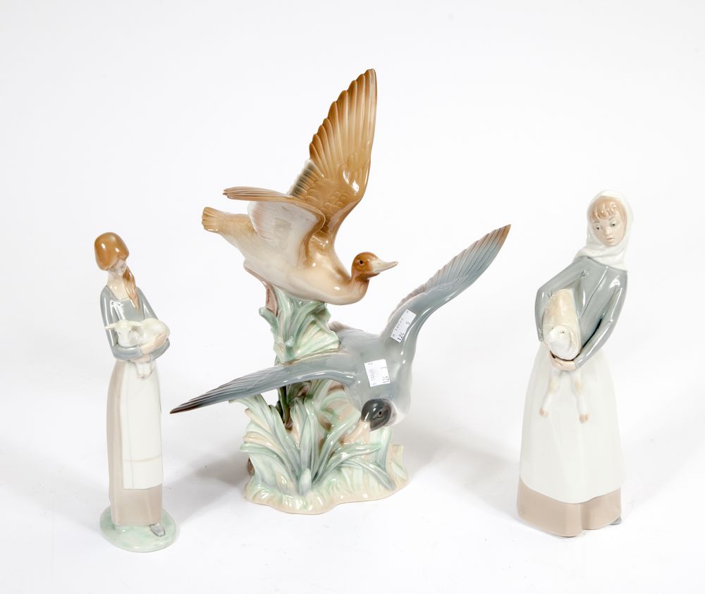 A LARGE LLADRO GROUP, 
modelled with two ducks taking flight, 13in (33cm); two Lladro figures,