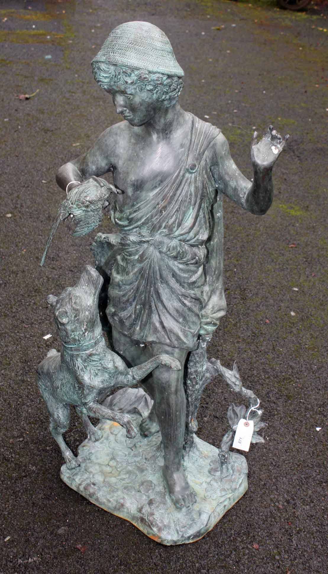 A CLASSICAL BRONZE GROUP, 
modern, modelled as a youth holding a dead pheasant with hound by his