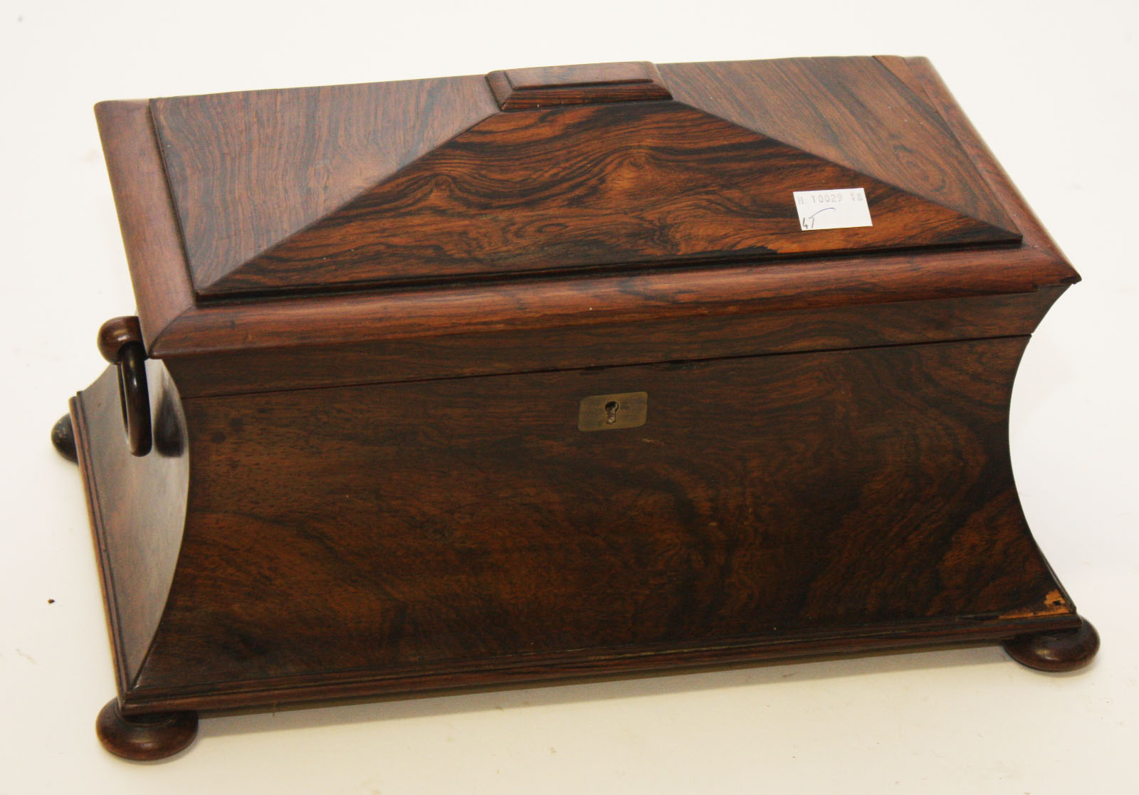 A WILLIAM IV RECTANGULAR ROSE WOOD TEA CADDY, 
of sarcophagus form, hinged cover opening to reveal