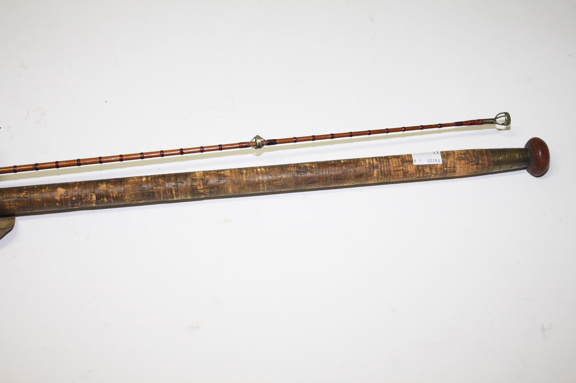 A TWO PART HARDY BROS FLY ROD, 
with cork grip, in canvas bag. (1)