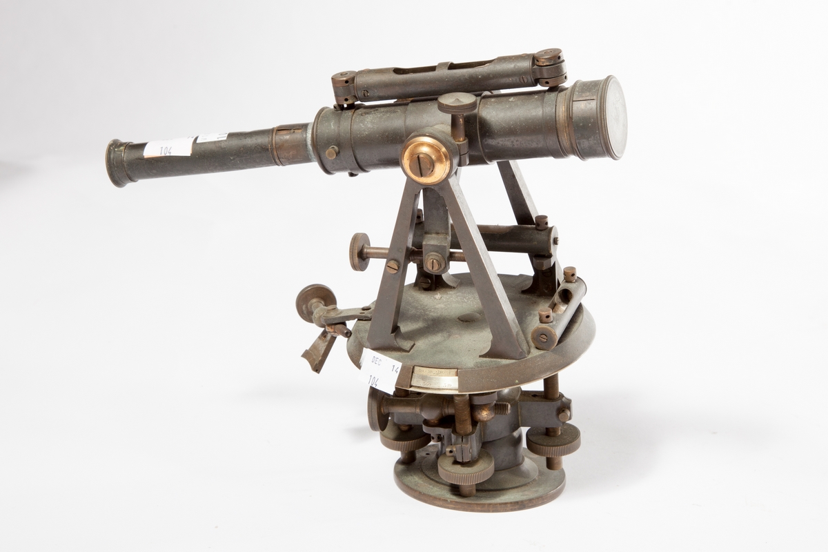 A SMALL OXIDISED BRASS THEODOLITE, 
with 10in (25cm) scope on double A arch supports, silvered