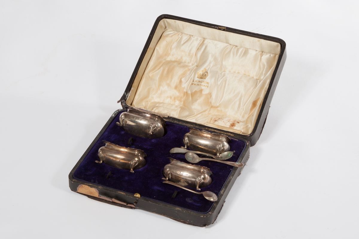 A CASED SET OF FOUR OGEE SHAPED RECTANGULAR SILVER SALT TUBS, 
Birmingham, early 19th century,