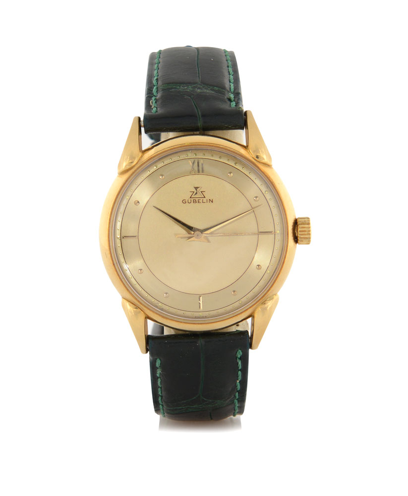 GUBELIN ANNI `50.  C. 18K yellow gold with teardrop lugs (very good). D. two-tone champagne with