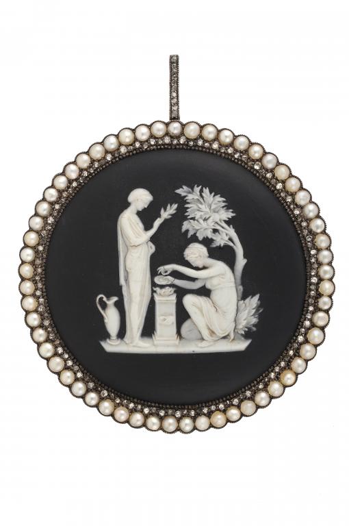 A WEDGWOOD BLACK JASPER DIP CAMEO OF A SACRIFICE TO CONCORDIA OR PEACE  set in  a gold pendant with