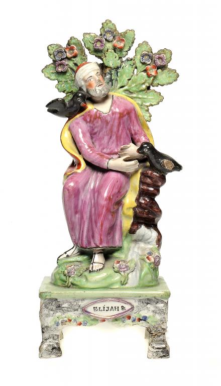 A STAFFORDSHIRE PEARLWARE TABLE BASE FIGURE OF ELIJAH  the title impressed in printer`s type ELIJAH