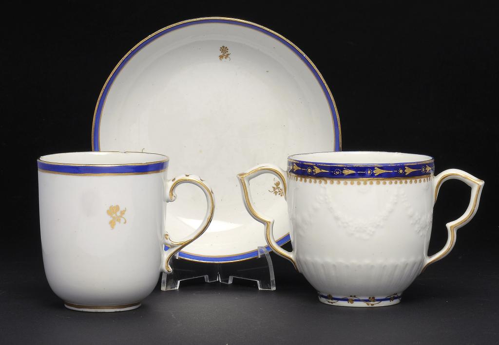 A DERBY TWO HANDLED CUP AND A DERBY CHOCOLATE CUP AND SAUCER  puce mark or blue crown and D, saucer