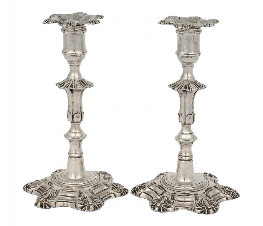 A PAIR OF PORTUGUESE ROCOCO CANDLESTICKS  by Jaoa Coelho Sampaio, Oporto, with shell cornered