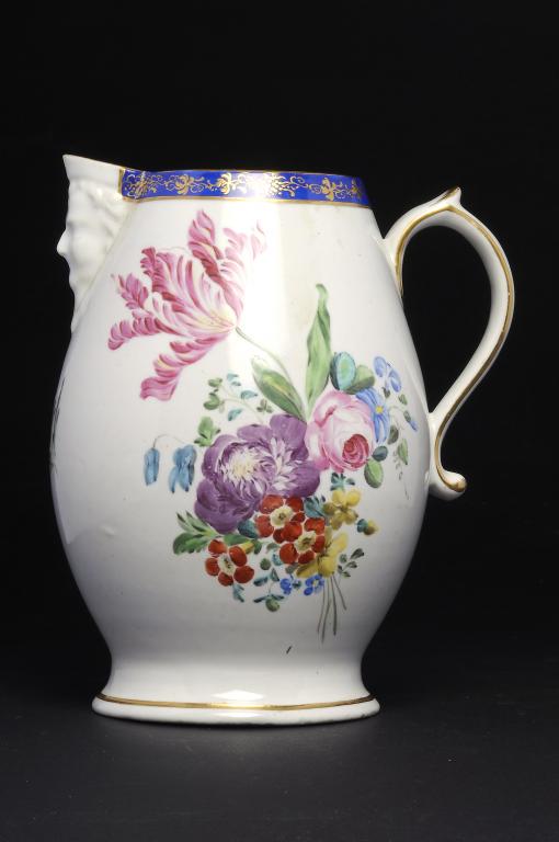 A DERBY JUG WITH MASK LIP,  well painted with a flower spray and subsidiary spray to the reverse