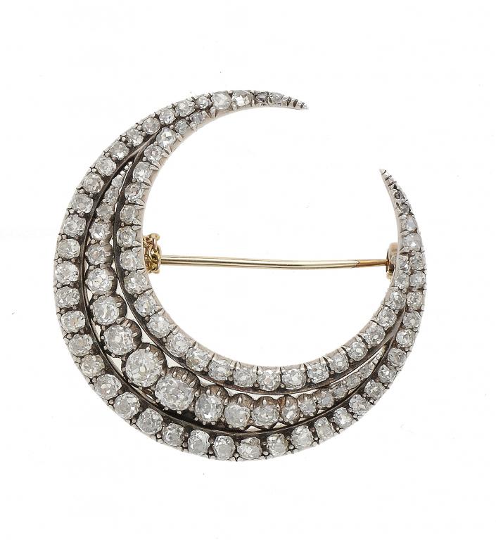 AN ANTIQUE DIAMOND CRESCENT BROOCH  mounted in silver and gold, c1900++Complete, requires cleaning,