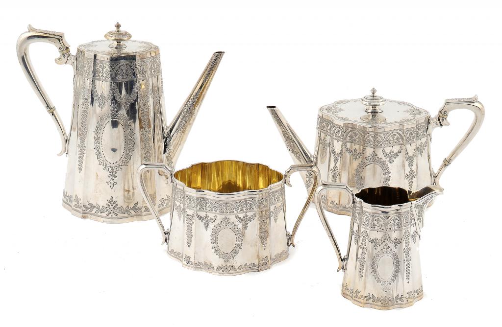 A VICTORIAN TEA AND COFFEE SERVICE by Edward Barnard & Sons, London 1885, can shaped and engraved