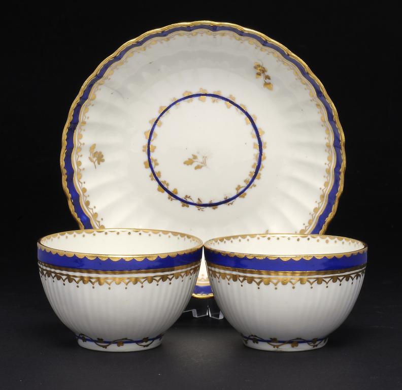 TWO DERBY BLUE AND GILT TEA BOWLS AND A SAUCER  puce mark, saucer 13.5cm diam, 1786++Saucer