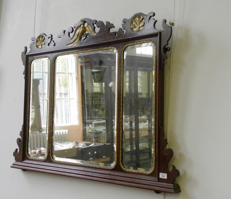 A GEORGE II STYLE PARCEL GILT MAHOGANY FRETTED FRAME OVERMANTEL MIRROR WITH THREE BEVELLED PLATES