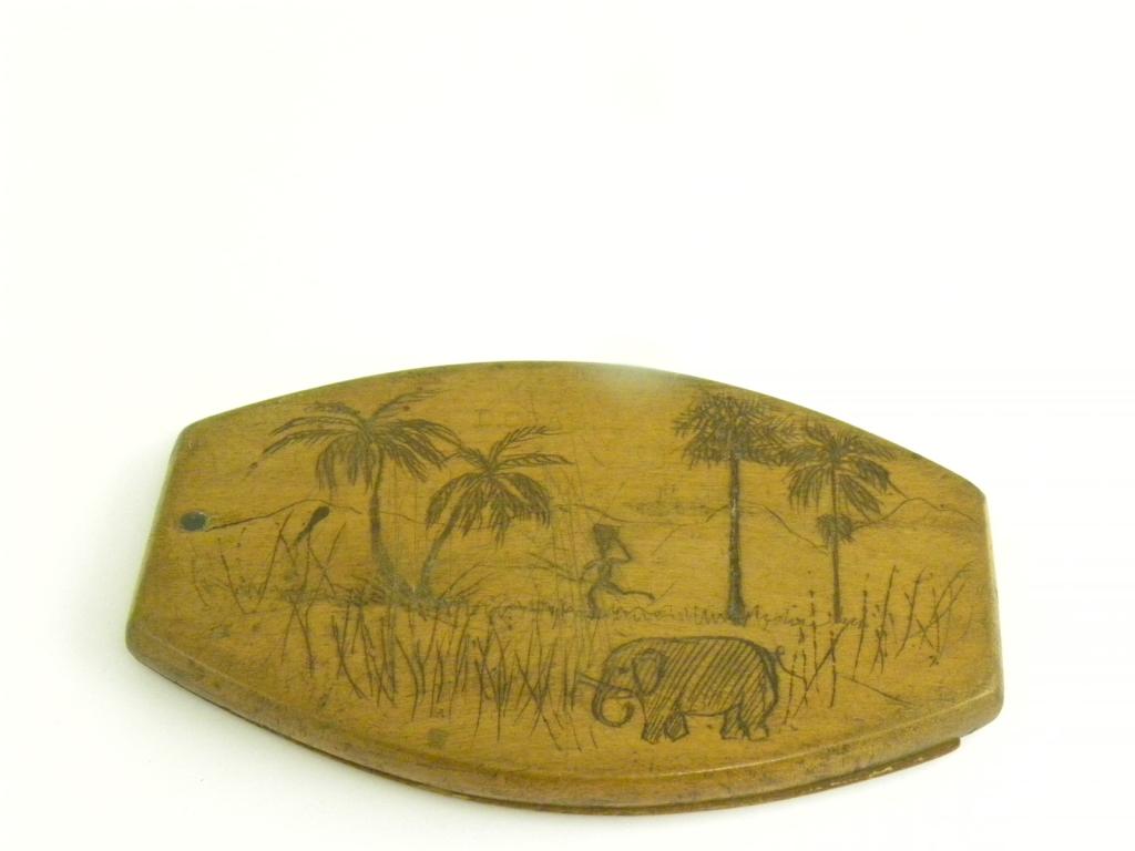 A SOLDIER`S WOODEN POCKET SHAVING MIRROR WITH PIVOTED COVER AND DECORATED IN PENWORK WITH A NATIVE