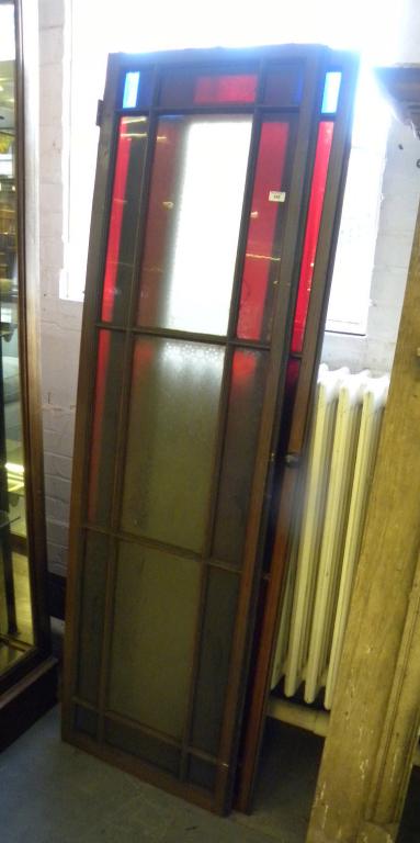 A PAIR OF LATE VICTORIAN GLAZED MAHOGANY DOORS WITH FIFTEEN EDGED OR COLOURED GLASS PANES