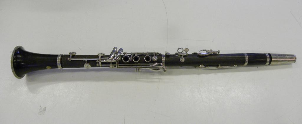 A CONN CLARINET, MAKER`S BRASS TRADE MARK WITH "CHOICE OF THE ARTISTS" STAMPED NUMBERS AND CONN USA