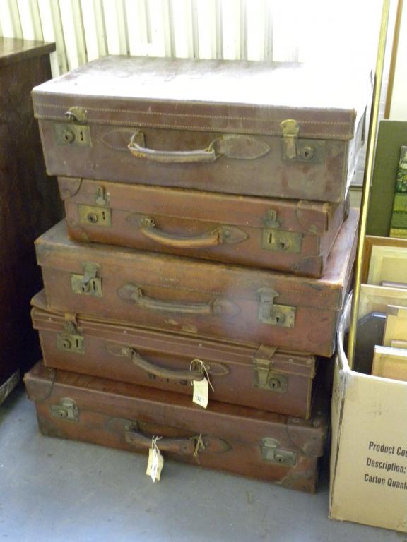 FIVE VINTAGE LEATHER SUITCASES