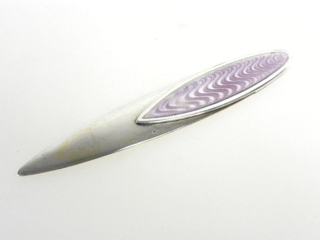 A SCANDINAVIAN SILVER AND MAUVE GUILLOCHE ENAMEL BOOKMARK, SHUTTLE SHAPED, CONTROL MARKS, EARLY 20TH
