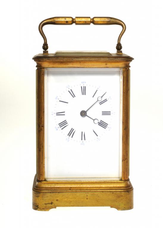 A FRENCH BRASS GIANT CARRIAGE CLOCK the white enamel mask dial with blue minutes, the gong