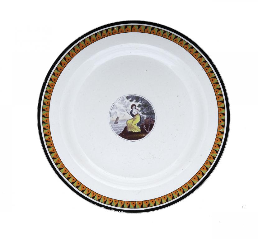 A CREAMWARE PLATE with a purple bat print of Hope heightened in enamels, the distinctive