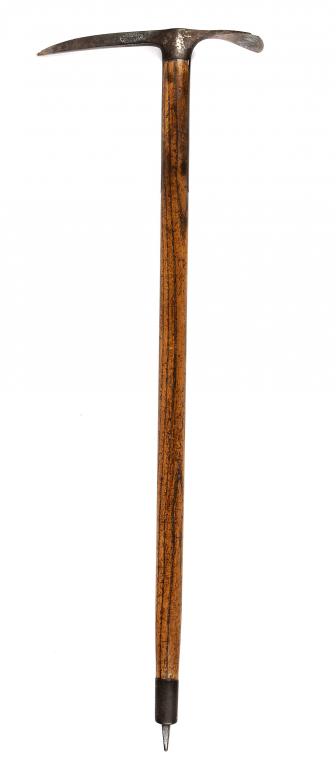 MOUNTAINEERING. A SWISS MOUNTAINEER`S ICE AXE BY ALFRED BHEND, with ash handle, 82cm l, oval stamped