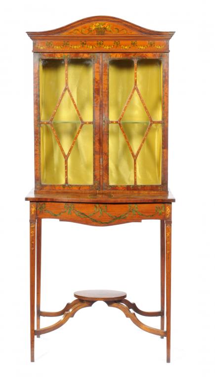 AN EDWARD VII PAINTED SATINWOOD CABINET the arched cornice above a pair of doors with lozenge